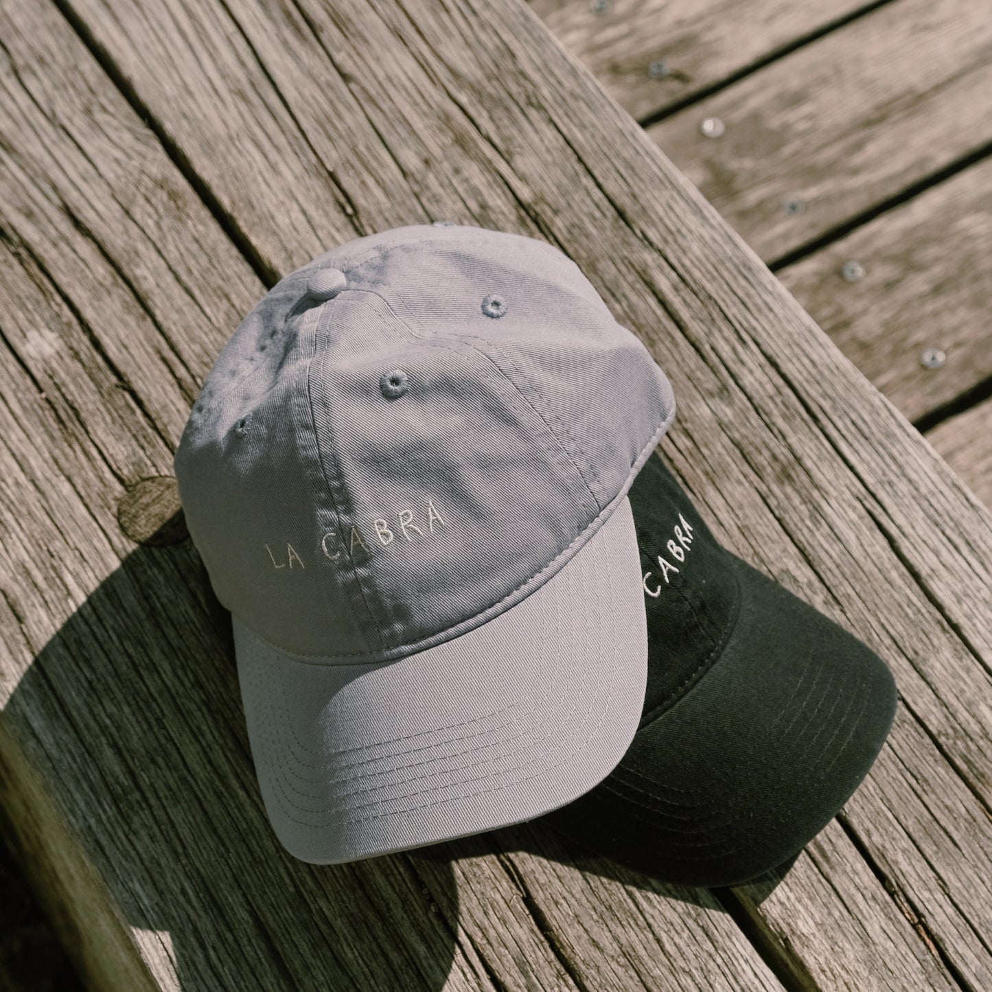 Blue and Black La Cabra caps environmental